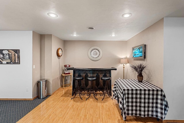 260 S Clay St, De Pere, WI 54115 - living area featuring a bar, recessed lighting, and wood finished floors