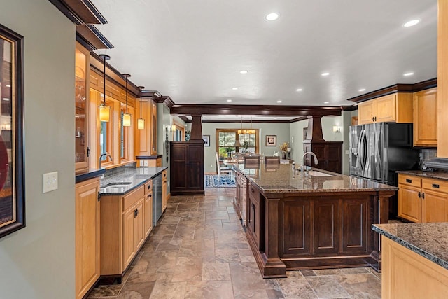 260 S Clay St, De Pere, WI 54115 - kitchen with stone tile flooring, wine cooler, recessed lighting, an island with sink, and dark stone countertops