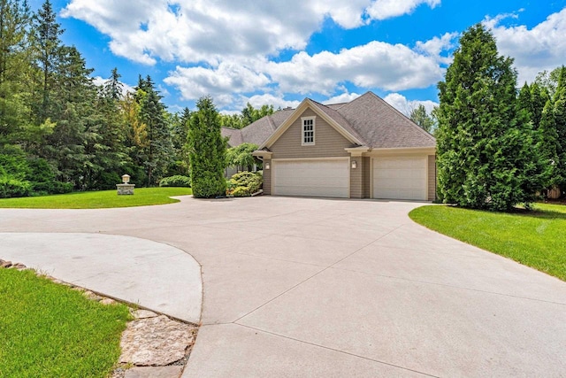 260 S Clay St, De Pere, WI 54115 - view of front of house with concrete driveway, a front yard, and an attached garage