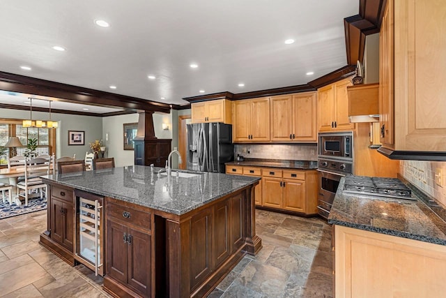 260 S Clay St, De Pere, WI 54115 - kitchen featuring appliances with stainless steel finishes, wine cooler, stone tile floors, decorative backsplash, and crown molding