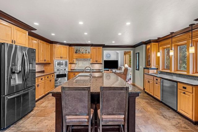 260 S Clay St, De Pere, WI 54115 - kitchen featuring appliances with stainless steel finishes, crown molding, stone tile flooring, backsplash, and dark stone counters