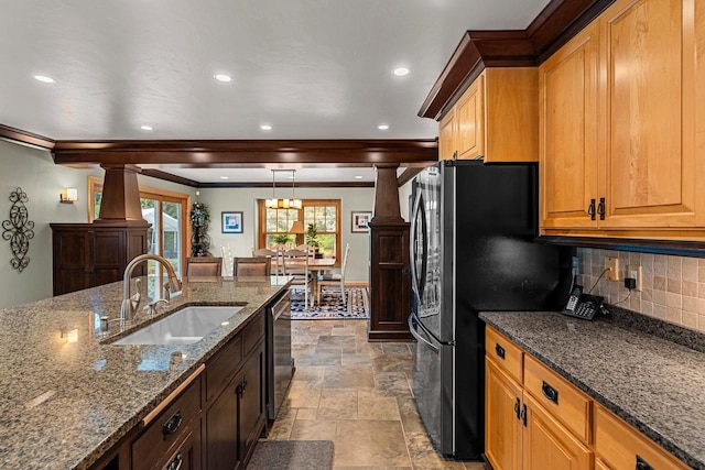 260 S Clay St, De Pere, WI 54115 - kitchen with ornamental molding, decorative backsplash, light stone finish flooring, dark stone countertops, and recessed lighting