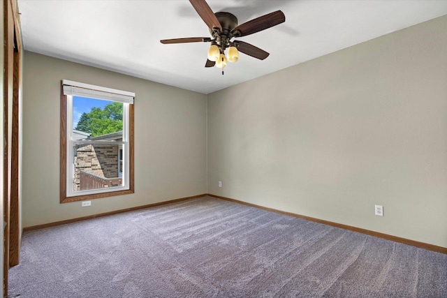 N114W16680 Crown Dr Unit 7, Germantown, WI 53022 - carpeted spare room featuring baseboards and a ceiling fan