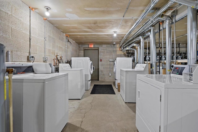 N114W16680 Crown Dr Unit 7, Germantown, WI 53022 - washroom featuring washing machine and clothes dryer and concrete block wall