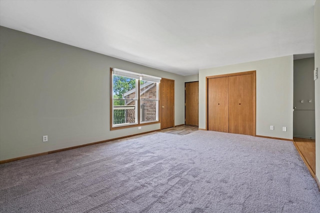 N114W16680 Crown Dr Unit 7, Germantown, WI 53022 - unfurnished bedroom with multiple closets and light colored carpet