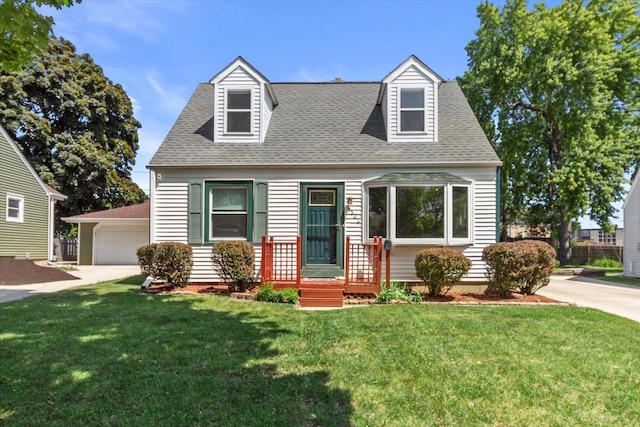 4502 W Sumac Pl, Milwaukee, WI 53219 - cape cod house featuring roof with shingles, a front yard, and a garage