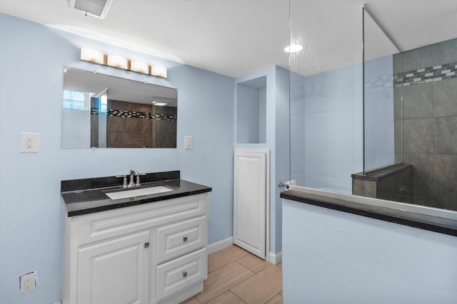 4502 W Sumac Pl, Milwaukee, WI 53219 - bathroom featuring vanity, walk in shower, and wood finished floors