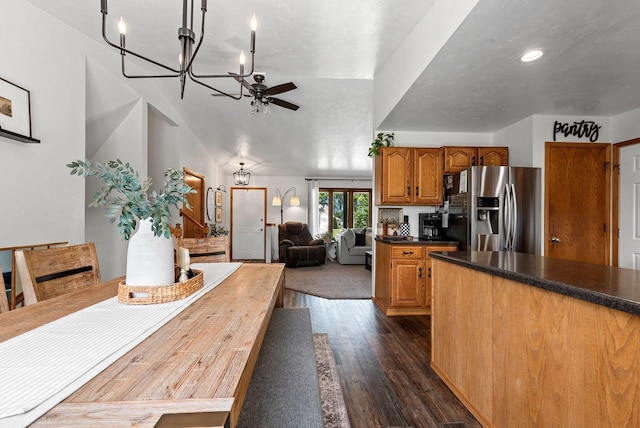4814 Placid Way, New Franken, WI 54229 - kitchen with stainless steel fridge with ice dispenser, a chandelier, dark wood-style floors, brown cabinets, and dark countertops