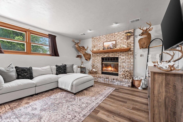 4814 Placid Way, New Franken, WI 54229 - living area featuring wood finished floors and a fireplace