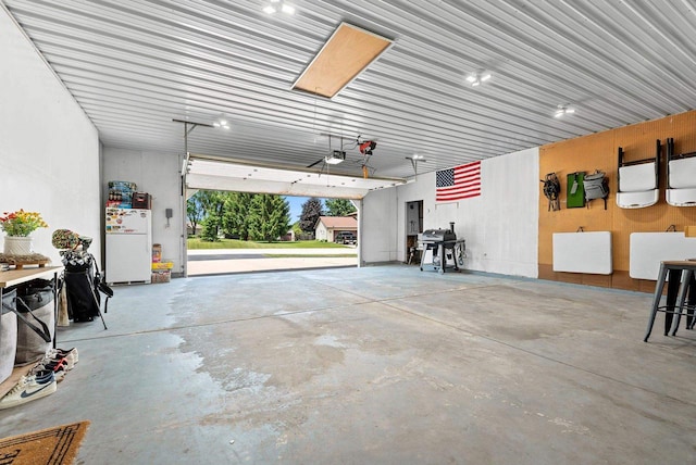 4814 Placid Way, New Franken, WI 54229 - garage with freestanding refrigerator, a garage door opener, and electric panel