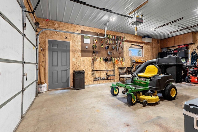 4814 Placid Way, New Franken, WI 54229 - garage featuring a garage door opener and a workshop area