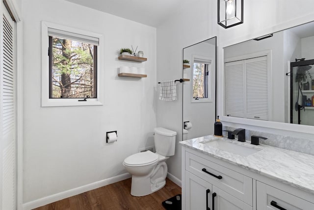 156550 Whispering Pine Ave, Wausau, WI 54403 - bathroom featuring a closet, vanity, and wood finished floors