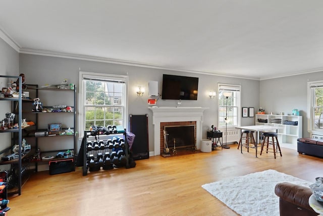 511 Wisconsin River Dr, Port Edwards, WI 54469 - living area with ornamental molding, wood finished floors, and a brick fireplace