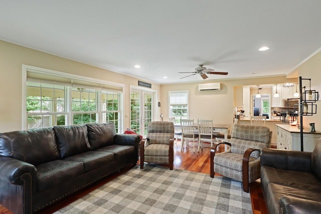 511 Wisconsin River Dr, Port Edwards, WI 54469 - living room with a wall unit AC, ornamental molding, ceiling fan, recessed lighting, and light wood-type flooring