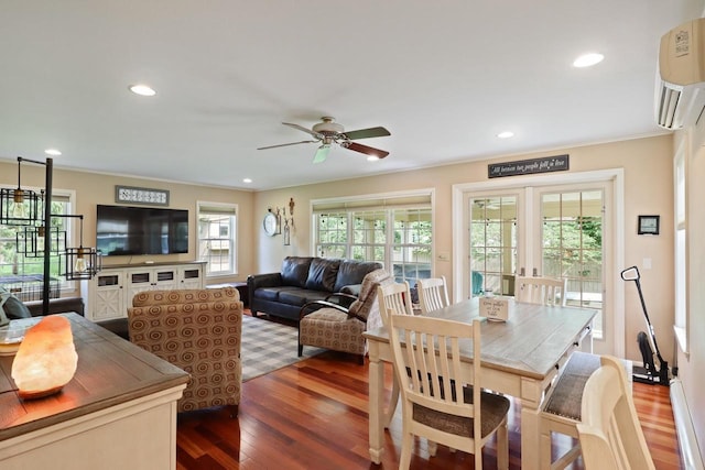 511 Wisconsin River Dr, Port Edwards, WI 54469 - living area featuring wood finished floors, ceiling fan, ornamental molding, a wall unit AC, and recessed lighting