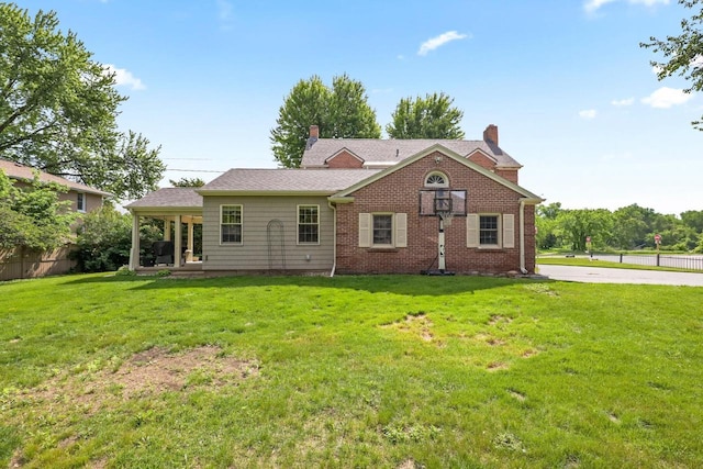 511 Wisconsin River Dr, Port Edwards, WI 54469 - view of front of property featuring a chimney and brick siding