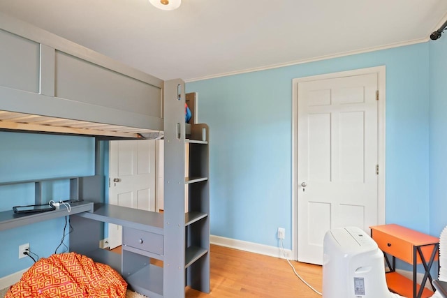 511 Wisconsin River Dr, Port Edwards, WI 54469 - bedroom with wood finished floors and crown molding
