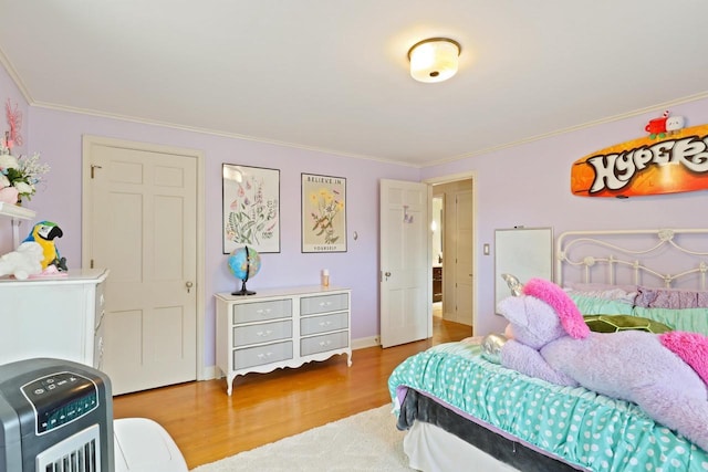 511 Wisconsin River Dr, Port Edwards, WI 54469 - bedroom with wood finished floors and crown molding