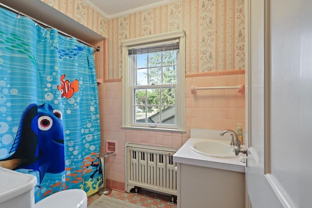 511 Wisconsin River Dr, Port Edwards, WI 54469 - full bath featuring radiator heating unit, tile walls, wallpapered walls, vanity, and ornamental molding