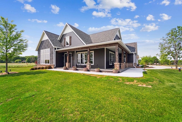 W9336 Lucy Ln, Hortonville, WI 54944 - back of house with a lawn, a shingled roof, and a patio area