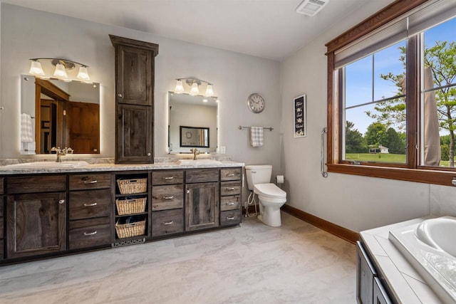 W9336 Lucy Ln, Hortonville, WI 54944 - bathroom featuring double vanity and baseboards