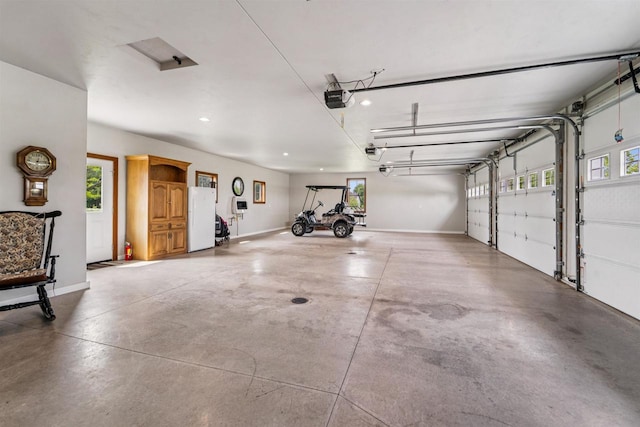 W9336 Lucy Ln, Hortonville, WI 54944 - garage with a garage door opener and recessed lighting