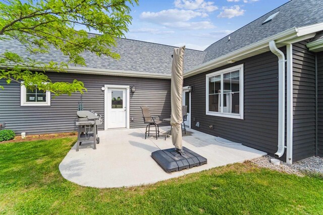 W9336 Lucy Ln, Hortonville, WI 54944 - rear view of property featuring a yard, roof with shingles, and a patio area