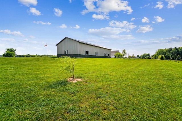 W9336 Lucy Ln, Hortonville, WI 54944 - view of green lawn with a pole building, an outdoor structure, and a view of rural / pastoral area