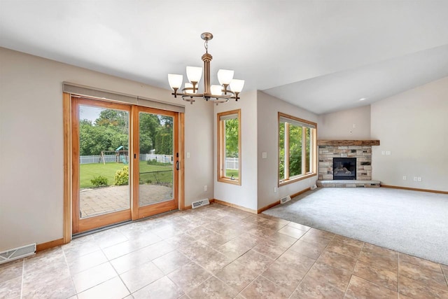 665 Black Earth Dr, De Pere, WI 54115 - unfurnished living room featuring a chandelier and a stone fireplace