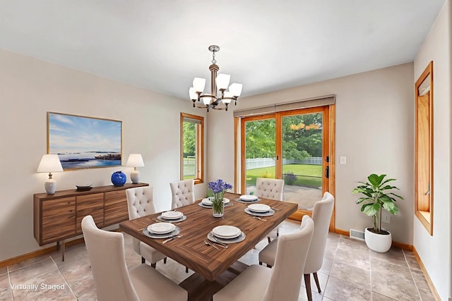 665 Black Earth Dr, De Pere, WI 54115 - dining room with a chandelier and light stone finish flooring