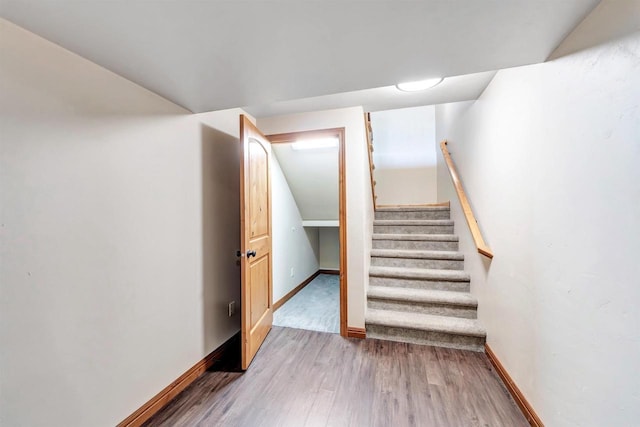 665 Black Earth Dr, De Pere, WI 54115 - staircase featuring wood finished floors and baseboards