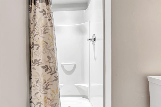 665 Black Earth Dr, De Pere, WI 54115 - bathroom with a shower stall and toilet