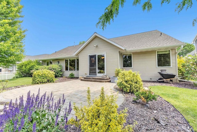 665 Black Earth Dr, De Pere, WI 54115 - rear view of house with a patio and roof with shingles