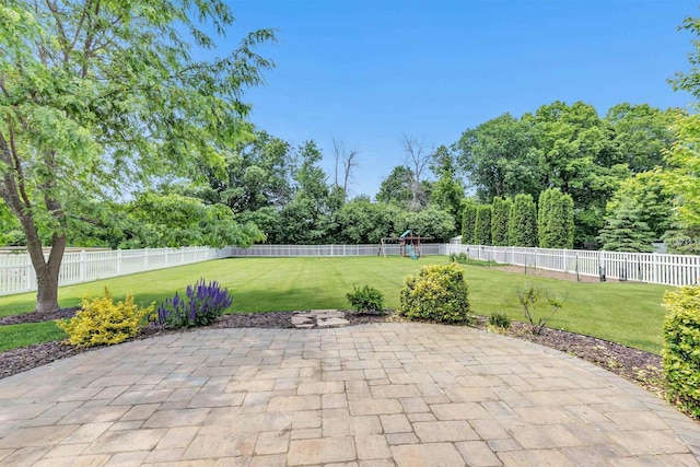 665 Black Earth Dr, De Pere, WI 54115 - fenced backyard with a patio and a playground