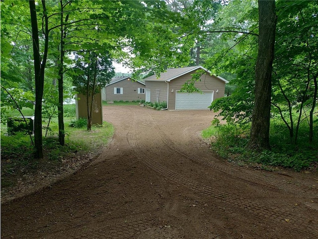 1959 79th St, Balsam Lake, WI 54853 - view of front of house with a garage, driveway, and an outbuilding
