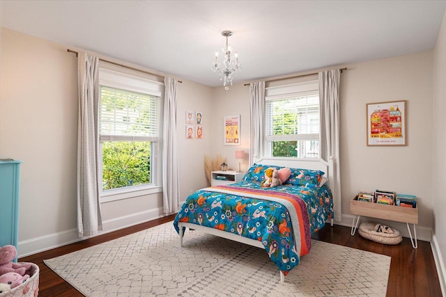 225 8th St, South Street, La Crosse, WI 54601 - bedroom featuring a chandelier, multiple windows, and dark wood-style floors