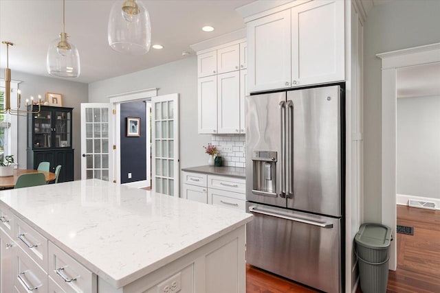 225 8th St, South Street, La Crosse, WI 54601 - kitchen featuring high end refrigerator, dark wood-type flooring, white cabinetry, and recessed lighting