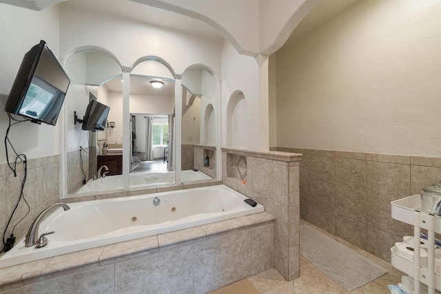 3287 E Old Highway 105, Superior, WI 54880 - full bath with a jetted tub, a wainscoted wall, and tile walls