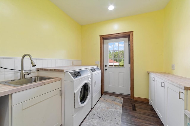 3287 E Old Highway 105, Superior, WI 54880 - laundry area featuring washing machine and clothes dryer, dark wood-style floors, and cabinet space