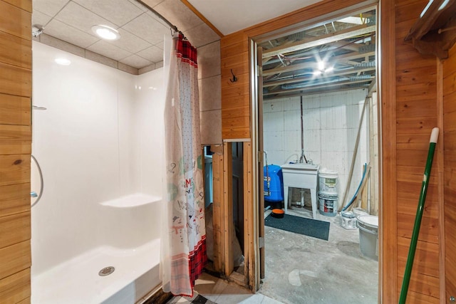 3287 E Old Highway 105, Superior, WI 54880 - bathroom with a stall shower, concrete flooring, and wooden walls