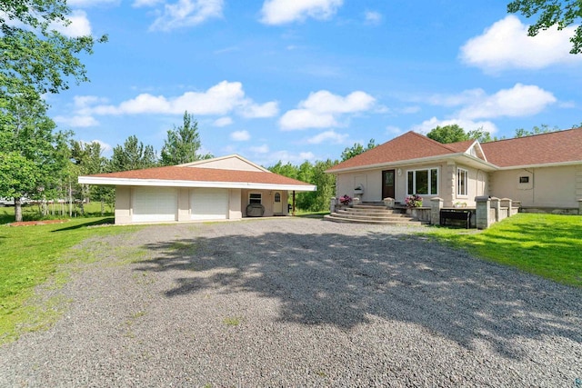 3287 E Old Highway 105, Superior, WI 54880 - ranch-style house featuring an outbuilding, a garage, and a front yard