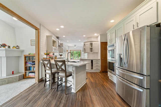 3287 E Old Highway 105, Superior, WI 54880 - kitchen featuring stainless steel appliances, a peninsula, dark wood-style floors, open shelves, and light countertops