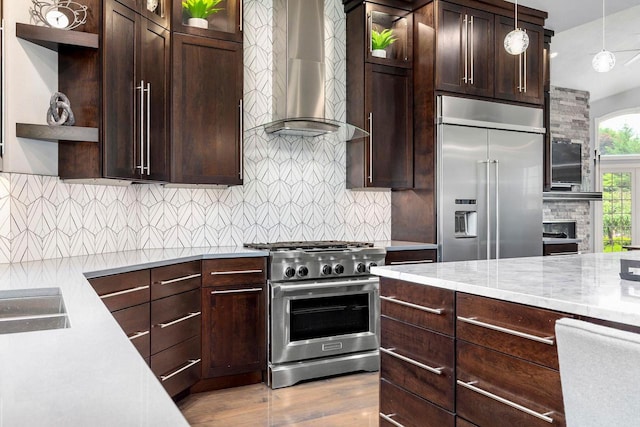W1977 Center Valley Rd, Kaukauna, WI 54130 - kitchen featuring high quality appliances, wall chimney range hood, open shelves, dark brown cabinetry, and wood finished floors