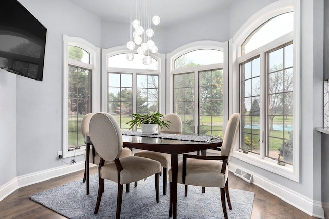 W1977 Center Valley Rd, Kaukauna, WI 54130 - dining area featuring healthy amount of natural light, dark wood-style flooring, and a chandelier