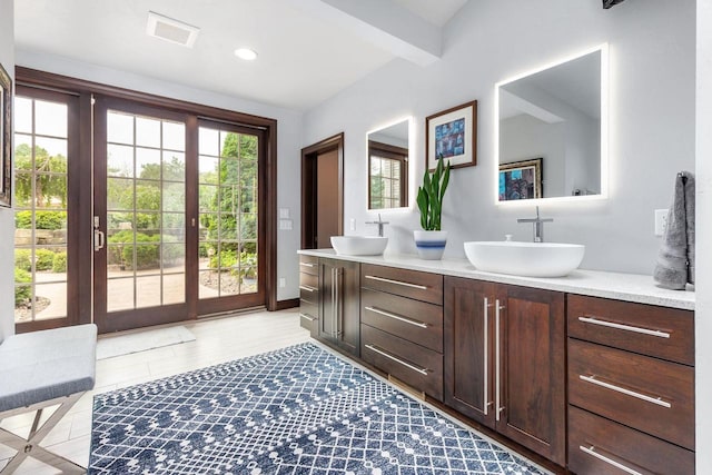 W1977 Center Valley Rd, Kaukauna, WI 54130 - bathroom featuring double vanity, beam ceiling, wood finished floors, and recessed lighting