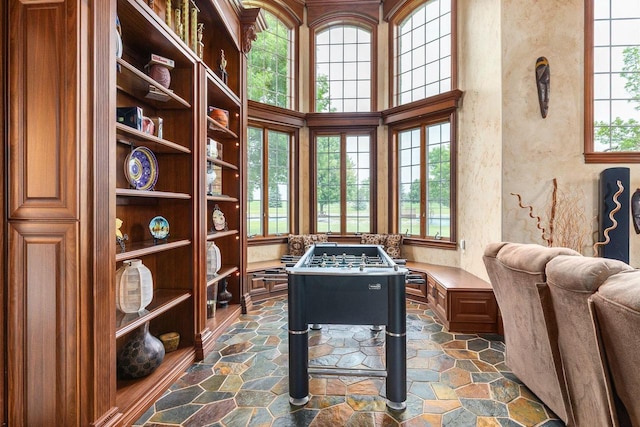 W1977 Center Valley Rd, Kaukauna, WI 54130 - recreation room featuring stone floors and a high ceiling