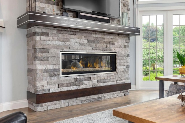 W1977 Center Valley Rd, Kaukauna, WI 54130 - detailed view of wood finished floors and a stone fireplace