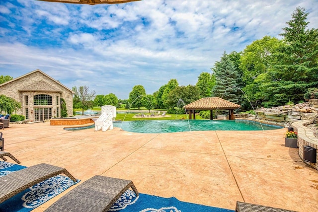 W1977 Center Valley Rd, Kaukauna, WI 54130 - swimming pool with a gazebo, an exterior structure, a patio area, an outdoor structure, and view of scattered trees
