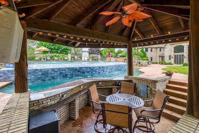 W1977 Center Valley Rd, Kaukauna, WI 54130 - view of patio with a gazebo, ceiling fan, and a community pool