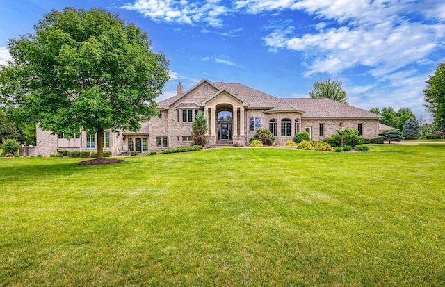 W1977 Center Valley Rd, Kaukauna, WI 54130 - view of front of property featuring a front lawn and a chimney